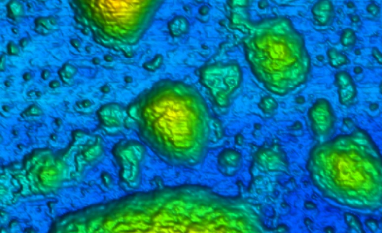 Tuning the Charge of Sliding Water Drops